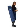 Woman carrying Apertura Tripod Case fully extended